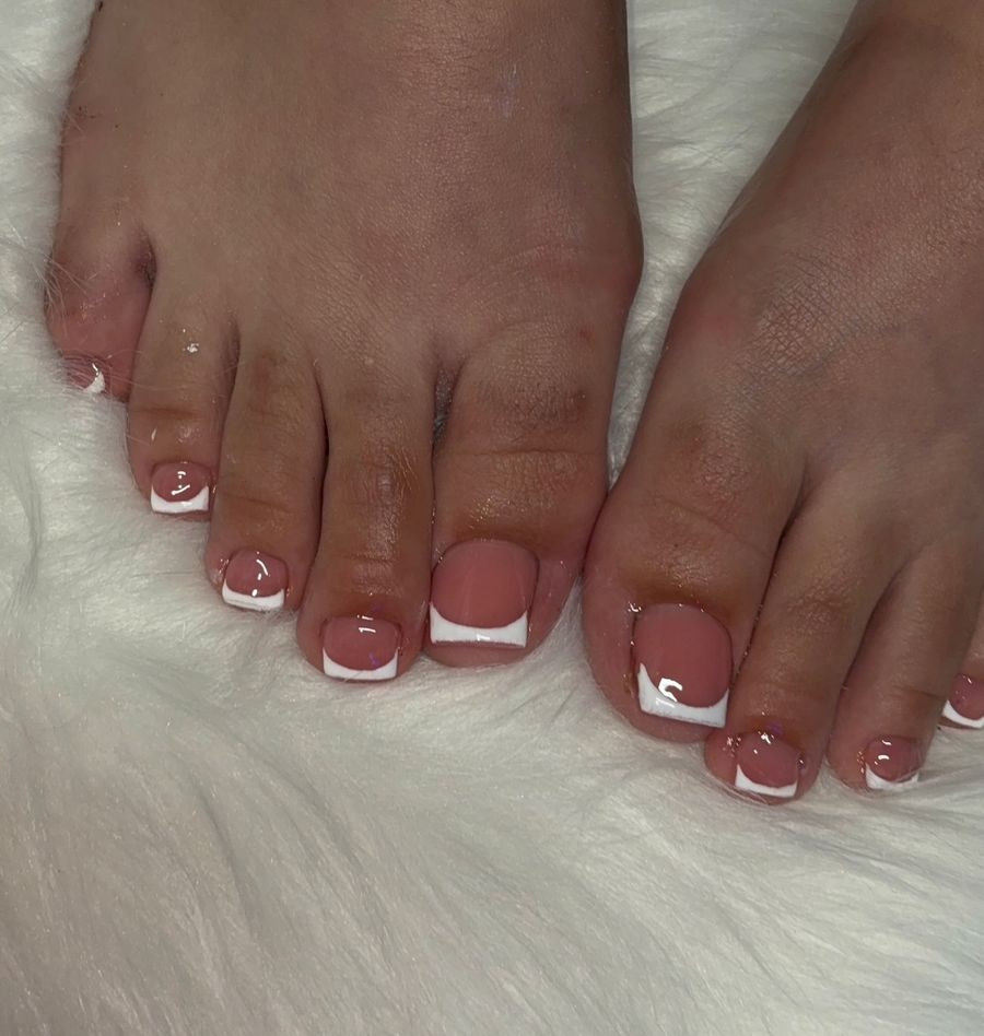 White French pedicure on white fur